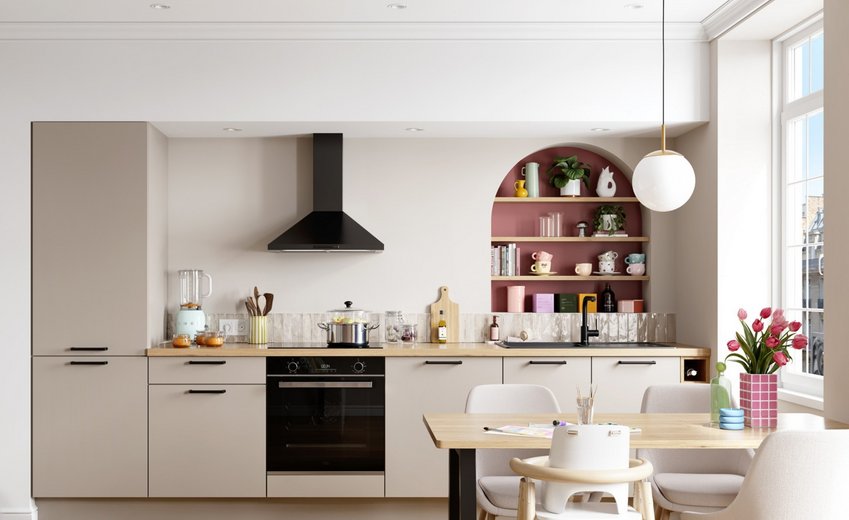 Cuisine moderne beige taupe avec plan de travail en bois clair, grande niche murale arrondie rose terracotta avec étagères et hotte cheminée noire.