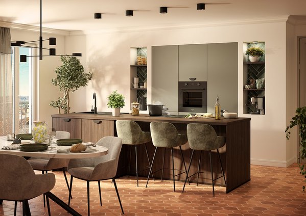 Keukeneiland in saliegroen en donker hout. Moderne keuken in saliegroen en donker hout, met een groot kookeiland met barruimte, en verlichte decoratieve nissen.