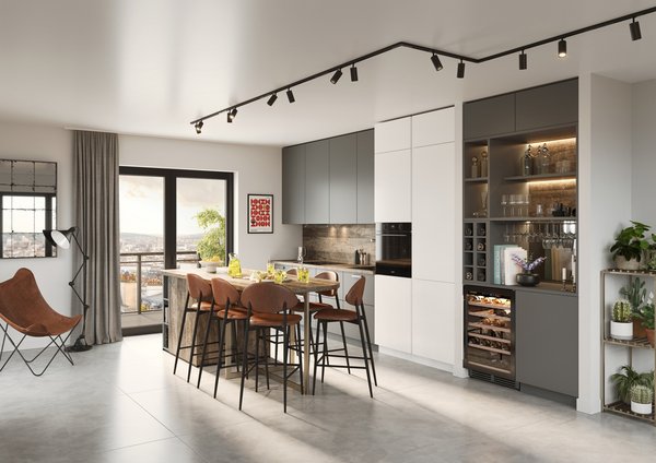 Open woonruimte met industriële keuken Moderne loft met industriële plafondverlichting, grijze keuken met houten bar, barkrukken en open verbinding met woonkamer.
